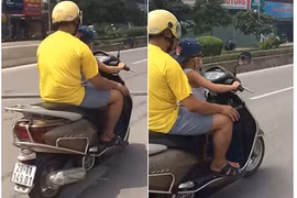 Thất kinh cảnh bé trai lái xe máy vi vu giữa HN