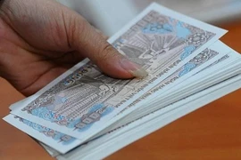 Phát hoảng phí đổi tiền lẻ sau Tết