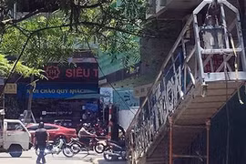 Đứt cáp sàn treo công trình, 3 người bị thương