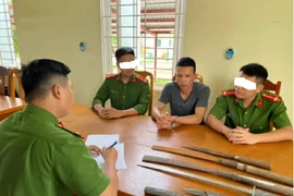 Đối tượng Phan Minh Châu tại cơ quan điều tra. Ảnh: Công an tỉnh Quảng Bình.