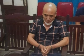 Đối tượng Nguyễn Sỹ Toàn và tang vật tại cơ quan công an. Ảnh: Công an tỉnh Nghệ An.