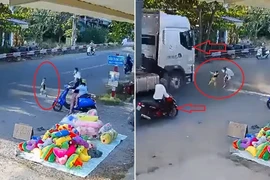 Clip: Bé trai chạy vụt ra đường đúng lúc xe container đang lao tới