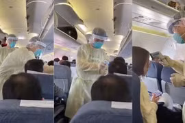Video từ tâm dịch Vũ Hán: Nhân viên y tế Trung Quốc mặc đồ chống virus kín người, quét thân nhiệt hành khách trên máy bay