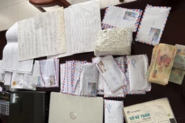 Tài liệu, tang vật vụ án bị cơ quan cảnh sát điều tra thu giữ.