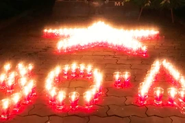 Hơn 15 ngàn ngôi mộ AHLS lung linh ngọn nến tri ân