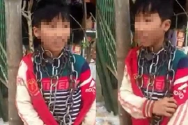 Chú ruột quấn xích quanh cổ cháu đến công an trình diện