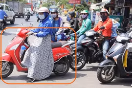 Phụ nữ cẩn thận các loại váy chống nắng khi đi xe máy