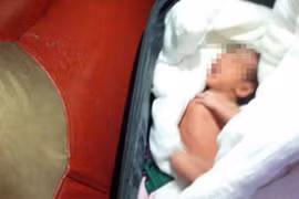 TQ: Bố giấu con sơ sinh trong vali mang đi bán