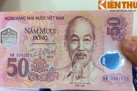 Ảnh độc về đồng tiền lưu niệm đầu tiên của NHNN