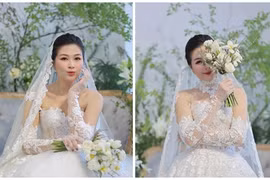 Vợ Huy Khánh hóa cô dâu gợi cảm khi về nước