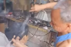 Ép tóc bằng kẹp than cực bá đạo tại Trung Quốc