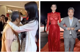 Bùi Lan Hương ân cần chỉnh áo cho đạo diễn Nguyễn Quang Dũng