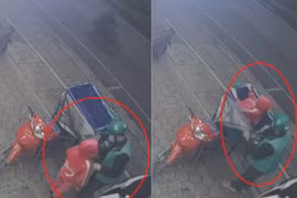 Cảm động hình ảnh ông bố shipper cho con ngồi vào giỏ hàng tránh rét