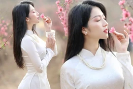 Nữ biên tập viên đẹp như nàng thơ lạc giữa vườn đào xuân