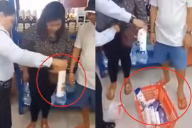 Video: Người phụ nữ giấu hơn chục món hàng trong người