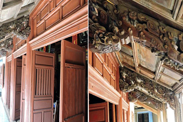 Ngôi nhà được dựng lên nhờ hơn 30 mét khối gỗ mít đỏ, gồm 3 gian chính, với 24 cột gỗ có kích thước lớn và được làm theo kiểu “nhà rường đắp đất” cùng hệ thống cửa bàn khoa, cột kèo “rau muống” chạm hình đầu Rồng hoặc đầu chim Phụng, cùng với đó là các hoành phi câu đối, án thờ được chạm khắc hoa văn công phu, tinh xảo Ảnh: eva.vn.