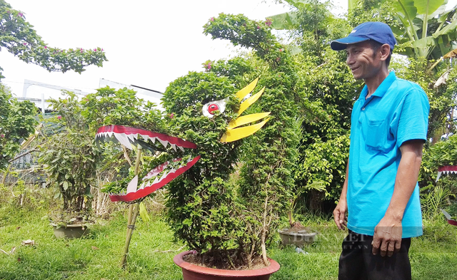 Ngắm “đầu rồng đuôi cá” được tạo từ những chậu hoa giấy - Hình 2 Ngam “dau rong duoi ca” duoc tao tu nhung chau hoa giay-Hinh-2