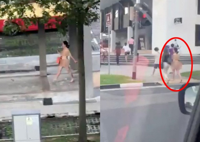 Người phụ nữ ngông nghênh đi bộ trên phố gây choáng Nguoi phu nu ngong nghenh di bo tren pho gay choang