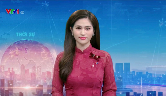 Vẻ đẹp mặn mà của BTV Minh Trang thời sự 19h Ve dep man ma cua BTV Minh Trang thoi su 19h