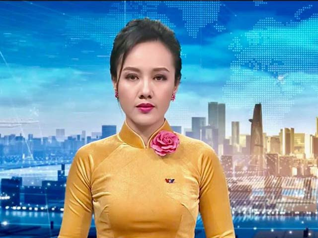 BTV Thời sự Hoài Anh bao năm gắn với chiếc áo dài - Hình 7 BTV Thoi su Hoai Anh bao nam gan voi chiec ao dai-Hinh-7