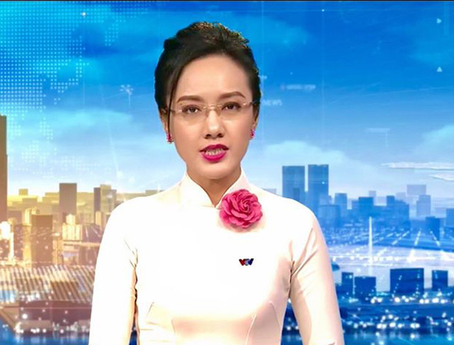 BTV Thời sự Hoài Anh bao năm gắn với chiếc áo dài - Hình 6 BTV Thoi su Hoai Anh bao nam gan voi chiec ao dai-Hinh-6