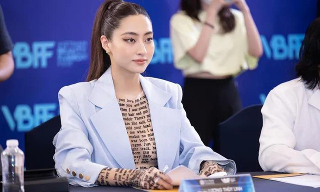 Hoa hậu Lương Thùy Linh 'xăm trổ đầy mình' đi làm giám khảo - Hình 2 Hoa hau Luong Thuy Linh 'xam tro day minh' di lam giam khao-Hinh-2
