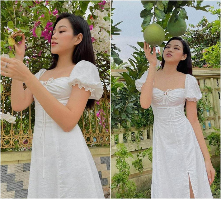 Không cần trưng trổ túi hiệu, Hoa hậu chỉ cần diện duy nhất một chiếc váy trắng tay bồng với thiết kế dúm ở ngực là đã toát lên vẻ dịu dàng vốn có, cũng như khoe khéo được đường cong cơ thể.