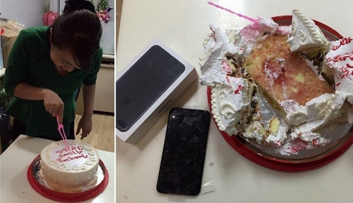 Trên chiếc bánh kem, bạn trai cô gái ghi dòng chữ “anniversary 4 years vợ yêu (kỷ niệm 4 năm vợ yêu)”, khi cắt bánh cô gái đã vô cùng bất ngờ bởi điện thoại iPhone 7 màu đen được bọc trong chiếc hộp. Ảnh: 24h.