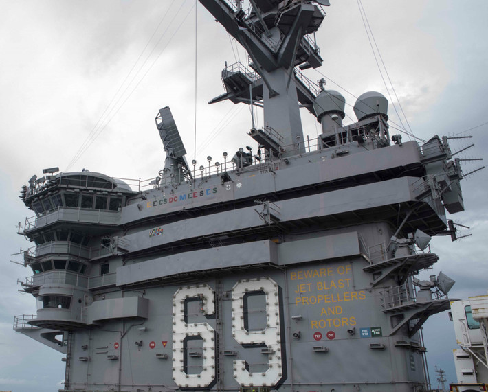 Cụ thể, tàu sân bay CVN-69 được trang bị hệ thống tác chiến điện tử AN/SLQ-32A, hệ thống đối phó ngư lôi SLQ-25A Nixie. Vũ khí trên tàu có 2 bệ phóng tên lửa RIM-7 Sea Sparrow, 2 bệ phóng tên lửa RIM-116, 3 hoặc 4 khẩu pháo 20mm. Tàu có thể mang theo được 90 máy bay chiến đấu cánh cố định và trực thăng.