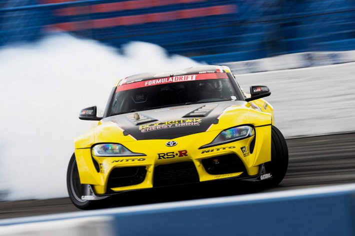 Chiếc xe gây ấn tượng đầu tiên chính là một chiếc Toyota GR Supra 202 mới màu xám nhám được khoác lên mình lớp áo được vẽ tay bởi họa sĩ Nicolai Sclater. Lớp áo này được vẽ theo phong cách nhằm tri ân phong cách vẽ Lost Art of Sign Painting đã từng phổ biến cách đây nhiều năm trước khi đồ họa máy tính trở nên thịnh hành. Mẫu xe này mang tên Ornamental Conifer GR Supra, được đặt theo biệt danh Ornamental Conifer của nghệ sĩ Nicolai Sclater