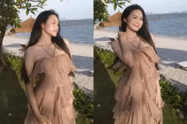 Doãn Hải My đẹp dịu dàng, e ấp khoe vai trần bên bờ biển