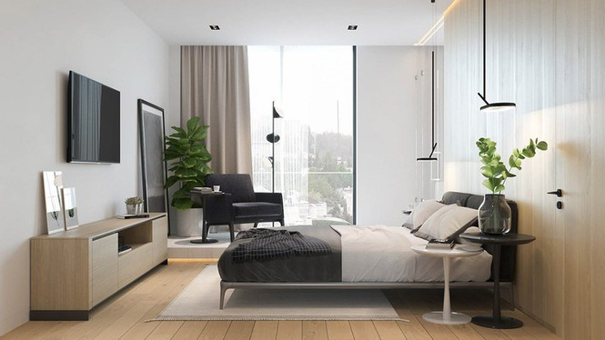 Bên kia giường, một chiếc ghế đọc sách thoải mái đặt sát với cửa sổ.
