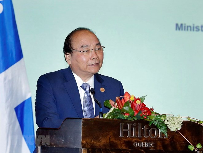 Ngay tại Tọa đàm, Thủ tướng Nguyễn Xuân Phúc đã trực tiếp trả lời nhiều câu hỏi của các nhà đầu tư Canada. (Ảnh: TTXVN)