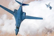 Máy bay ném bom B-1B với tiêm kích Qatar hộ tống.