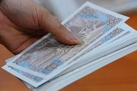 Phát hoảng phí đổi tiền lẻ sau Tết