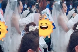 Đi đu idol Super Junior, cô gái chơi trội mặc váy cưới đội voan