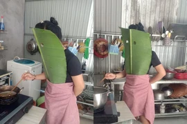 Vào bếp rán cá, người phụ nữ có màn bảo hộ kín người