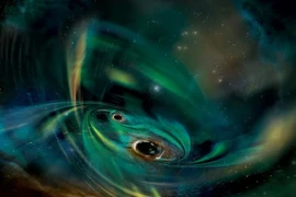 Hai hố đen siêu khủng cùng 'ngấu nghiến' vật chất giữa các vì sao 