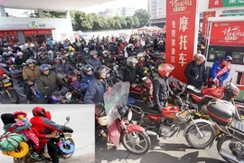 Hàng triệu xe máy tại Trung Quốc "đội rét" về quê ăn Tết 