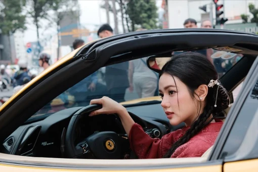 Hot girl TikTok Bò Chảnh diện áo dài đỏ nổi bật bên siêu xe