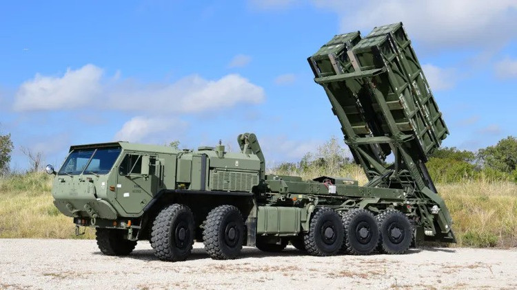The new ground launcher is capable of carrying up to 20 227mm guided rockets, quadrupling the firepower of the current HIMARS system. lockheed-martin-lvsr-launcher-truck.jpg