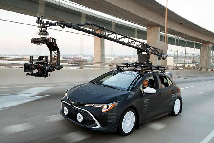 Tiếp theo là chiếc Corolla của nhà độ rất nổi tiếng là Hoonigan. Đây là mẫu xe chuyên dùng để quay film (chase camera car) trong những video clip thương mại của Hoonigan. Chiếc xe này khác biệt với hầu hết những mẫu chase camera car chuyên nghiệp ở chỗ hệ thống máy quay có thể được tháo rời, và được sử dụng như một chiếc xe bình thường trên đường.