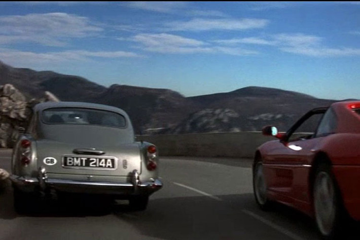 Aston Martin DB5 1965 xuất hiện trong cảnh quay dượt đuổi mở màn giữa Bond và sát thủ Xenia Onatopp (Famke Janssen) trên chiếc Ferrari 355 xuyên qua vùng đồi núi Monaco. Model này ra mắt thị trường lần cuối vào năm 2001 và trở thành mẫu xe đắt giá nhất mà Bond từng lái.