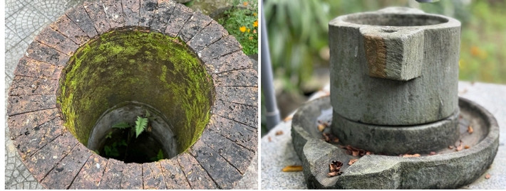 Ngoài giếng cổ, sân nhà còn có cối xay bằng đá. Ảnh: Người lao động