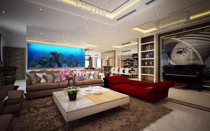 Phòng khách ấm cúng nhưng không kém phần sang trọng khi được trang bị ghế sofa đôi và 2 sofa nhỏ.