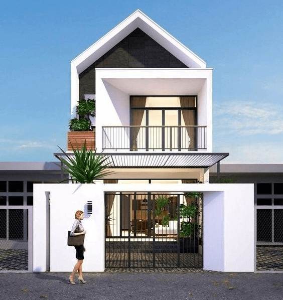 Mẫu nhà ống có sự kết hợp hoàn hảo của 2 gam màu lên ngôi 2021 là trắng và xám. Mặt tiền được xử lý khéo léo, tạo hiệu ứng sâu và rộng. Ảnh: Trananhgroup.
