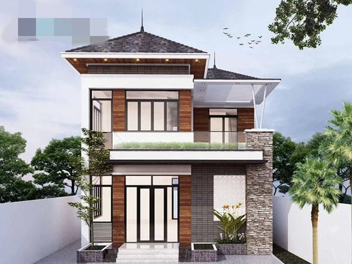 Nhà 2 tầng mang phong cách tối giản với những đường nét khỏe khoắn, sử dụng vật liệu tiên tiến, phù hợp với gia đình trẻ yêu thích sự năng động. Ảnh: Igcons
