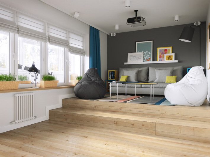 Phòng khách được chia làm hai nửa, trong đó một nửa được giật cấp sàn, là nơi bố trí bàn ghế để gia chủ và khách thư giãn.