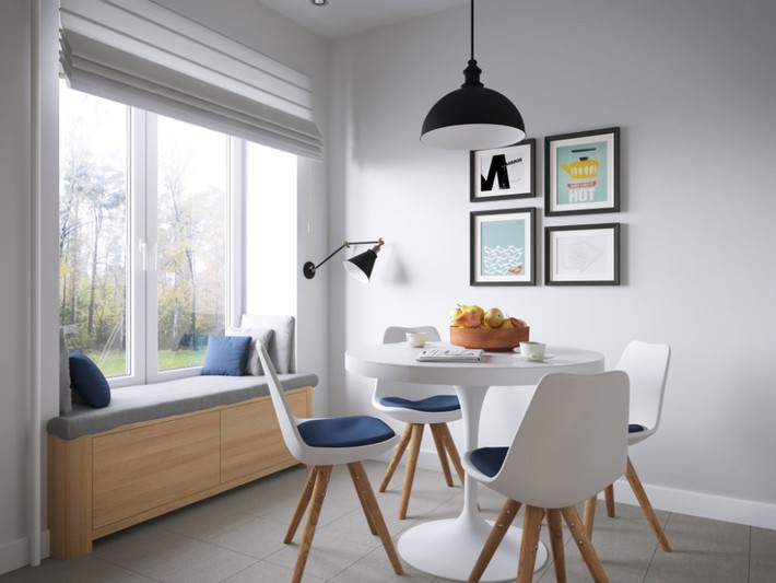 Bàn ăn thiết kế nhỏ gọn và giản dị bố trí cạnh cửa sổ để lấy ánh sáng.
