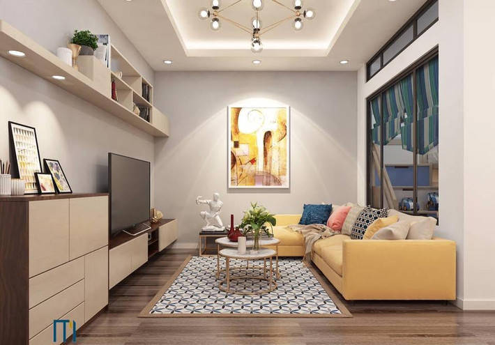 Giải pháp thiết kế giúp căn hộ nhỏ nhà anh Hoan rộng, đẹp và thoáng hơn được Công ty CP Kiến trúc và Nội thất Milimet đảm nhiệm. Giải pháp đầu tiên đó là thay bức tường nặng nề ngăn giữa phòng khách và phòng ngủ của con trai bằng hệ thống vách kính vừa giúp lấy ánh sáng vào phòng khi các con vui chơi và học tập, lại giúp phòng khách trông rộng và thoáng hơn. Khi các con cần không gian riêng để ngủ nghỉ thì có thể hạ tấm rèm cửa dày dặn xuống.
